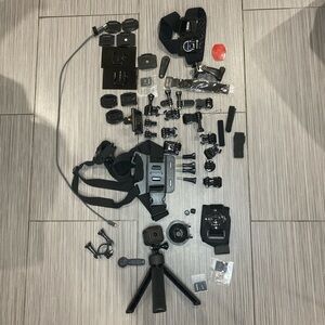 Black GoPro Camera with Tripod and accessories/attachments